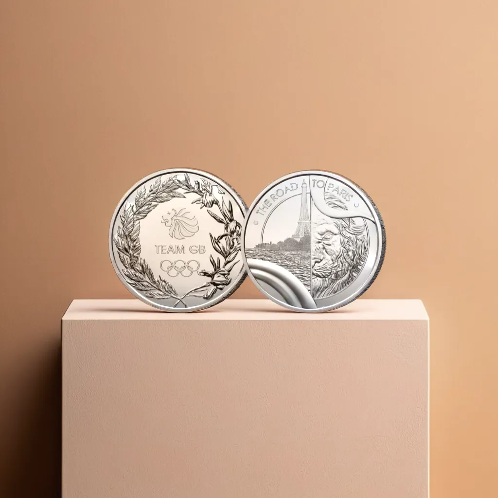 a silver coin on a beige wall