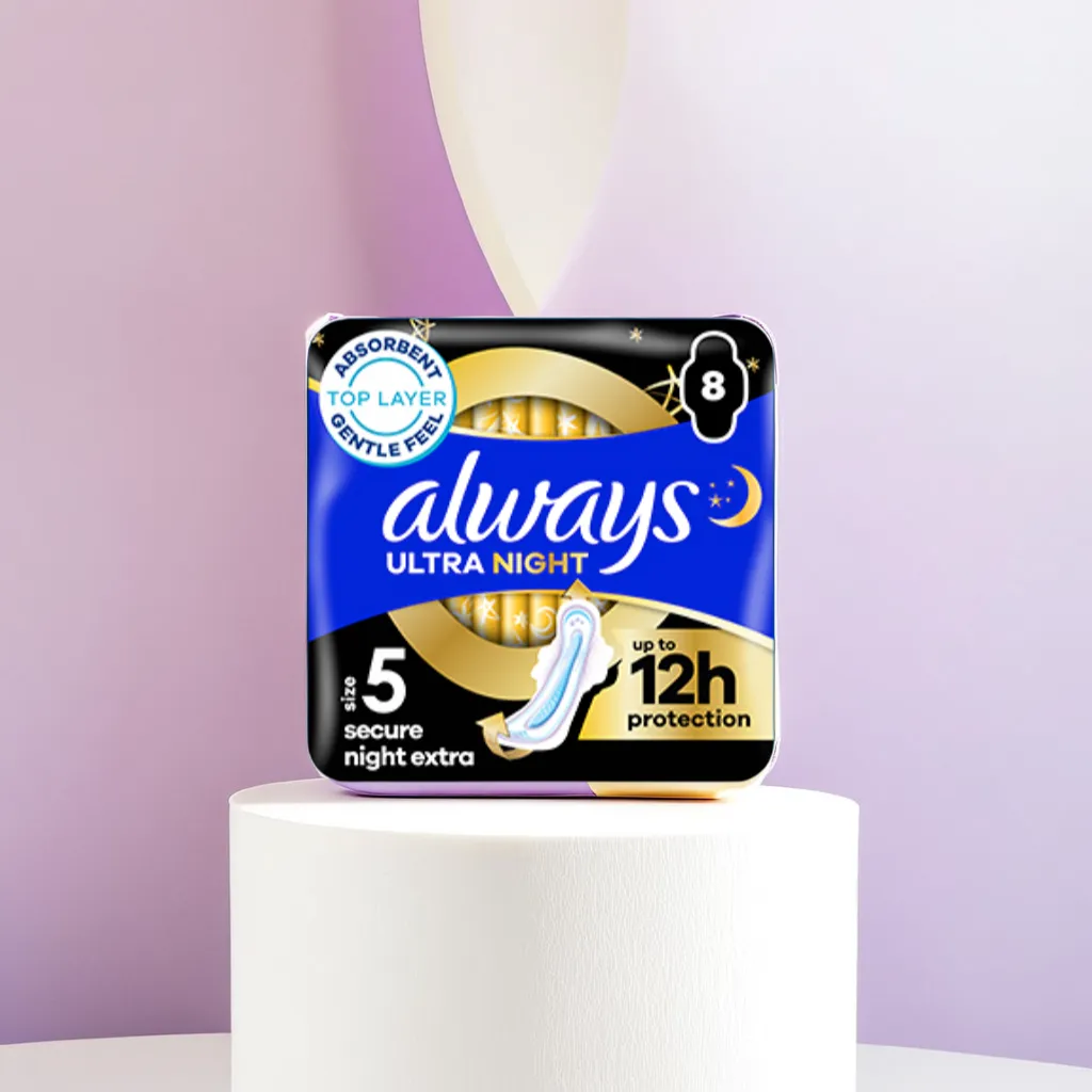 Always Ultra & Platinum pads on a soft pastel lavender pedestal, spot-lit in a bright airy studio. The pack is open to show the individual pad, placed at a slight angle to show its Comfort Lock wings. Surround it with delicate white fabric folds suggesting movement and comfort. Use a neutral off-white background, with gentle side lighting casting soft shadows to emphasise texture and luxury